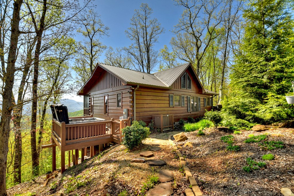 783 North Moreland Drive North Blue Ridge, GA 30513 - Photo 22 of 54 a house that has tree in front of it