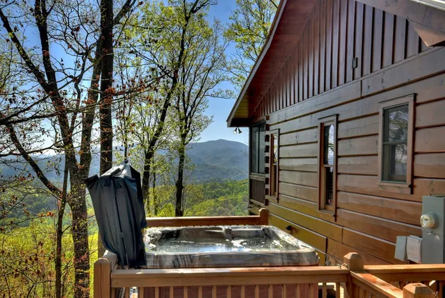 a view of a patio with wooden floor chairs and a table
