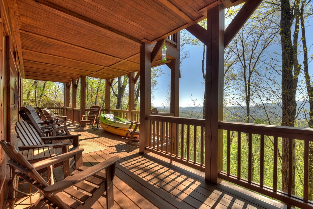 783 North Moreland Drive North Blue Ridge, GA 30513 - Photo 28 of 54 a view of a patio with wooden floor chairs and a table
