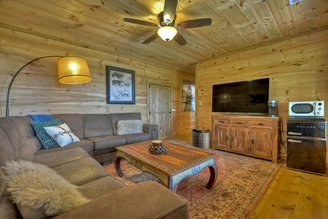 a view of a chairs and table in a backyard