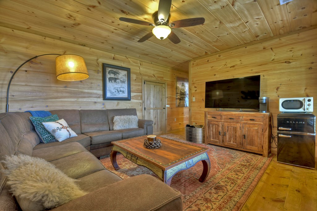 783 North Moreland Drive North Blue Ridge, GA 30513 - Photo 29 of 54 a living room with furniture and a flat screen tv