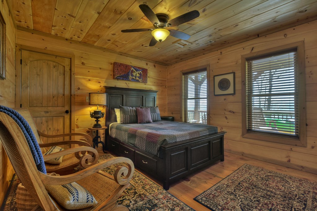 783 North Moreland Drive North Blue Ridge, GA 30513 - Photo 31 of 54 a bedroom with bed and a chandelier