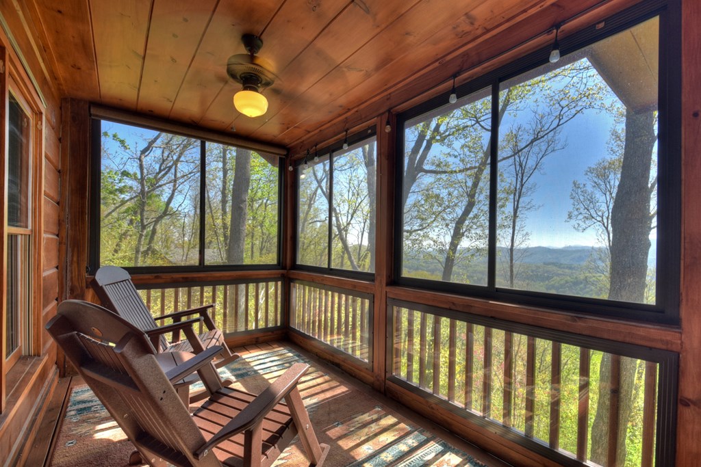 783 North Moreland Drive North Blue Ridge, GA 30513 - Photo 35 of 54 a view of a porch with furniture and wooden floor