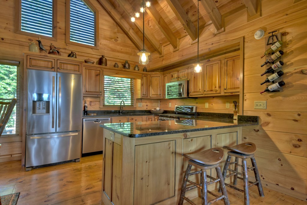 783 North Moreland Drive North Blue Ridge, GA 30513 - Photo 40 of 54 a kitchen with stainless steel appliances granite countertop a sink and cabinets