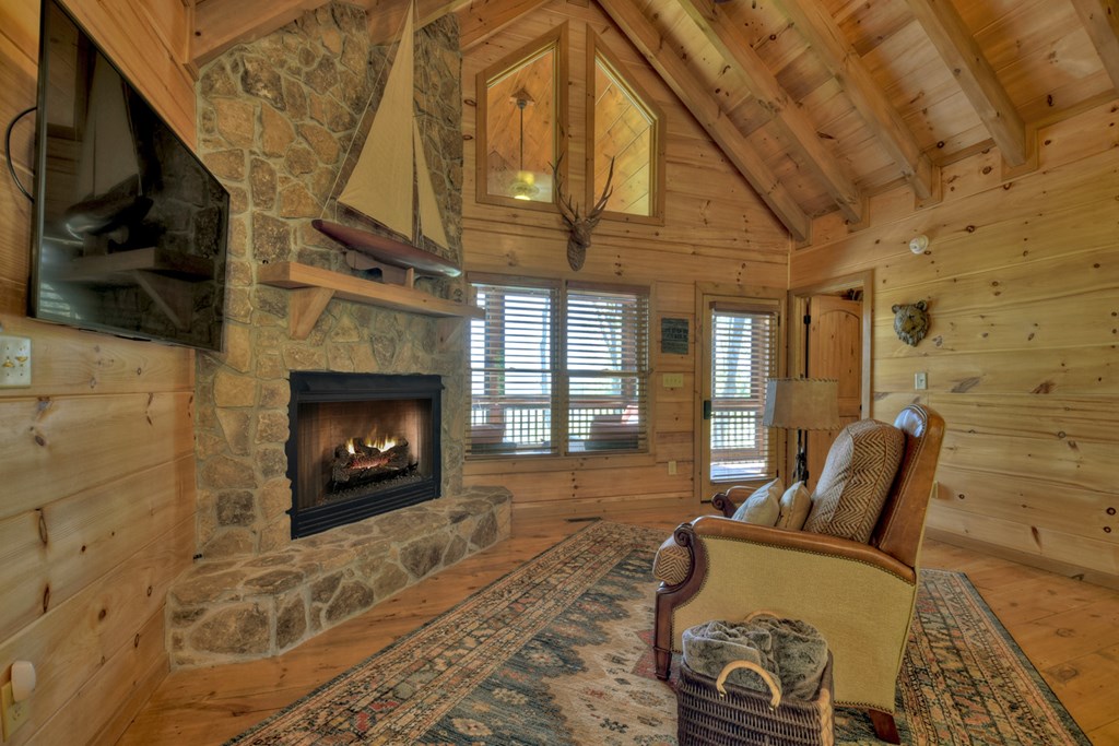 783 North Moreland Drive North Blue Ridge, GA 30513 - Photo 41 of 54 a living room with furniture and a fireplace