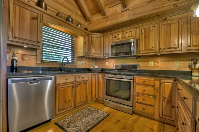 a bedroom with bed and wooden floor