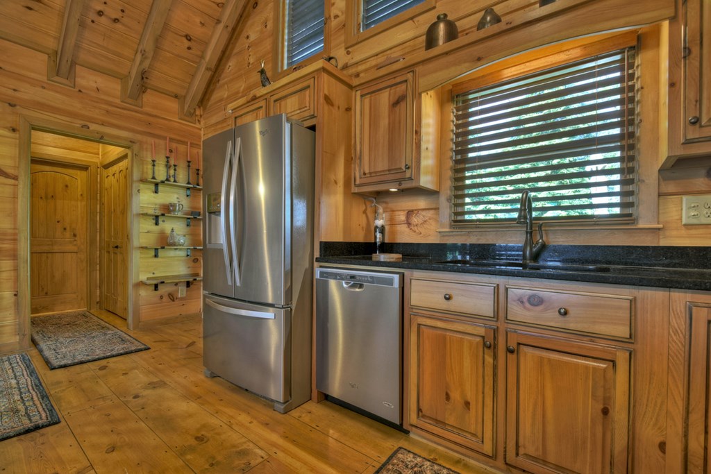 783 North Moreland Drive North Blue Ridge, GA 30513 - Photo 47 of 54 a kitchen with stainless steel appliances granite countertop a refrigerator and a sink