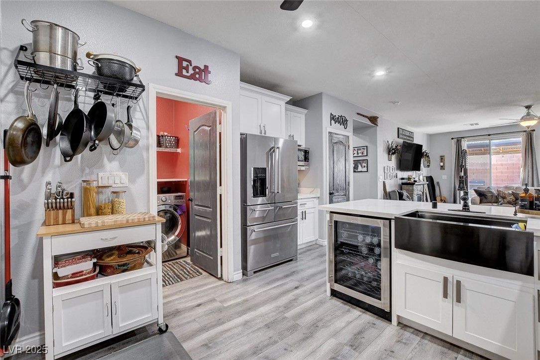 5929 North Caddy Ridge Street North Las Vegas, NV 89031 - Photo 13 of 37 Kitchen with high end white cabinetry, light wood-type flooring