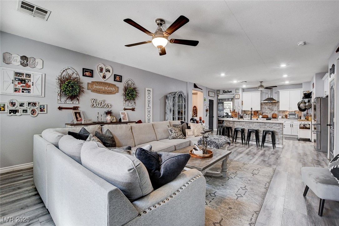 5929 North Caddy Ridge Street North Las Vegas, NV 89031 - Photo 16 of 37 Living area with a ceiling fan, recessed lighting, and light wood-style flooring