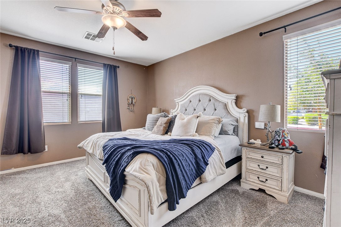 5929 North Caddy Ridge Street North Las Vegas, NV 89031 - Photo 17 of 37 Carpeted bedroom with baseboards and a ceiling fan