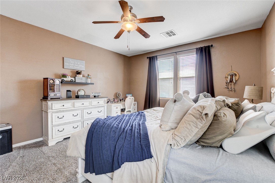 5929 North Caddy Ridge Street North Las Vegas, NV 89031 - Photo 18 of 37 Bedroom with light colored carpet and ceiling fan