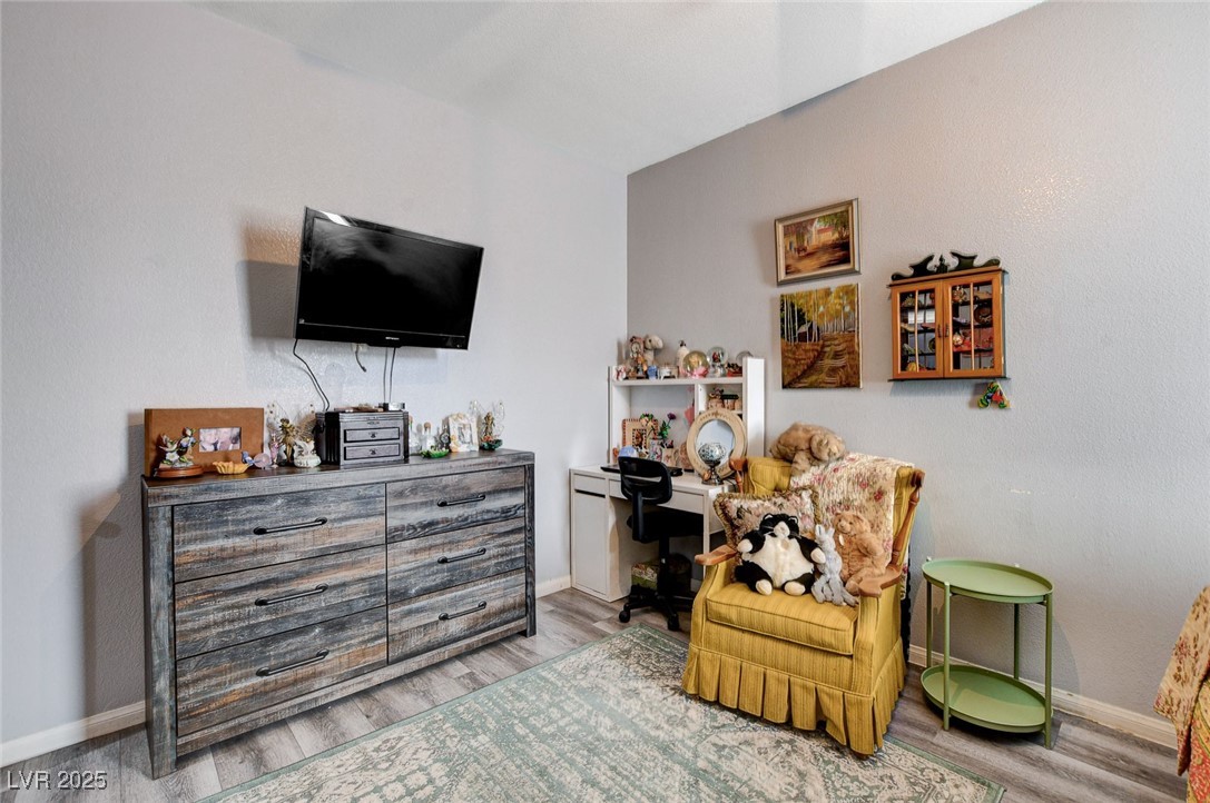 5929 North Caddy Ridge Street North Las Vegas, NV 89031 - Photo 26 of 37 Living area with wood finished floors and an office area