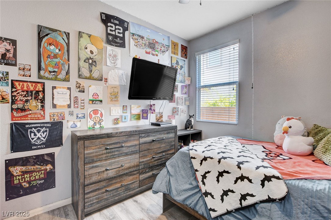 5929 North Caddy Ridge Street North Las Vegas, NV 89031 - Photo 29 of 37 Bedroom featuring light wood finished floors and baseboards