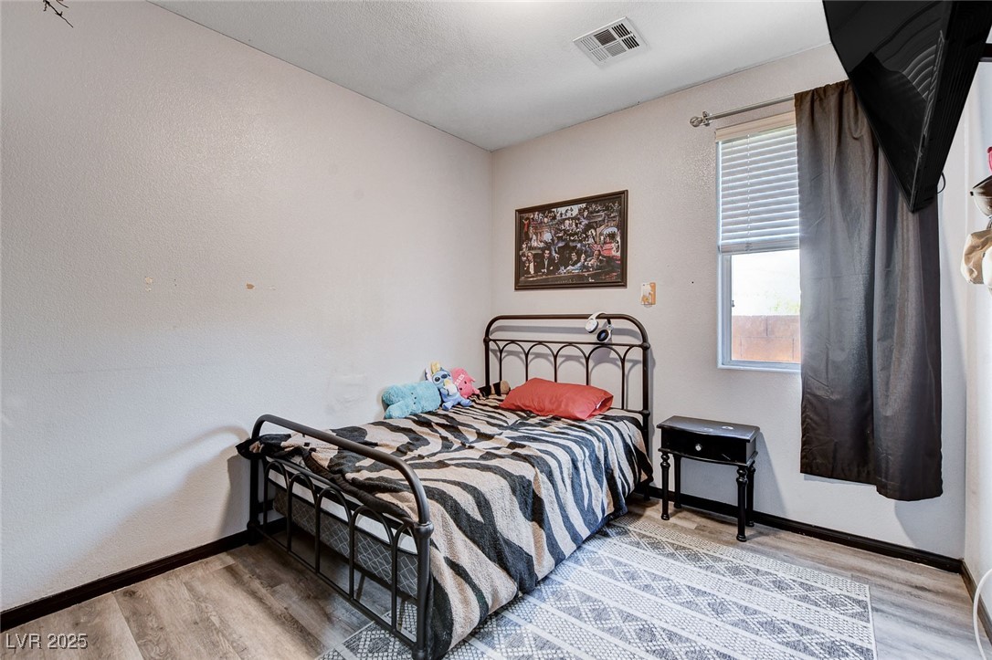5929 North Caddy Ridge Street North Las Vegas, NV 89031 - Photo 30 of 37 Bedroom featuring wood finished floors and baseboards
