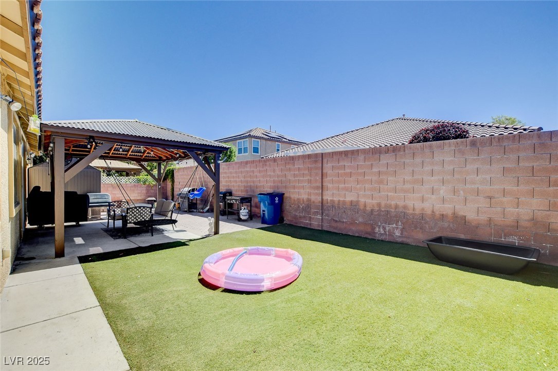 5929 North Caddy Ridge Street North Las Vegas, NV 89031 - Photo 36 of 37 Fenced backyard featuring a gazebo and a patio area