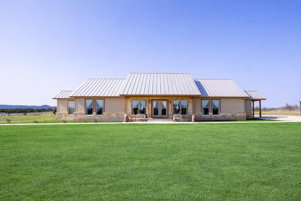 5025 Highway 16 Bandera, TX 78003 - Photo 1 of 49 a front view of a house with garden