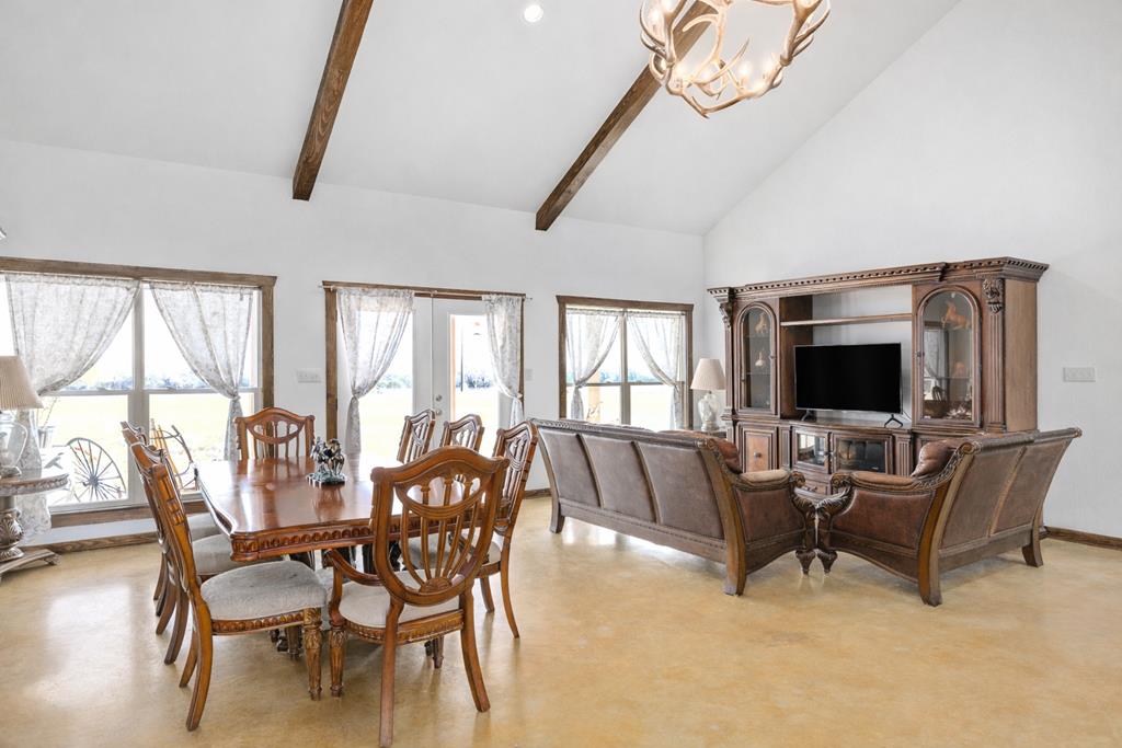 5025 Highway 16 Bandera, TX 78003 - Photo 12 of 49 a living room with furniture and a flat screen tv