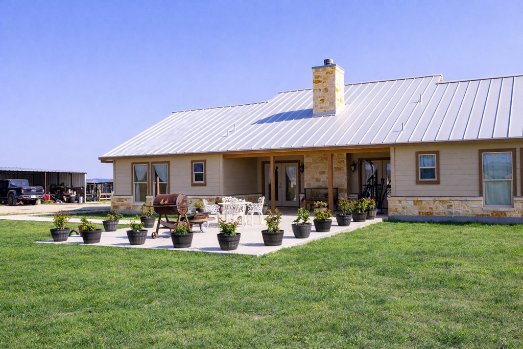 5025 Highway 16 Bandera, TX 78003 - Photo 2 of 49 a front view of a house with garden