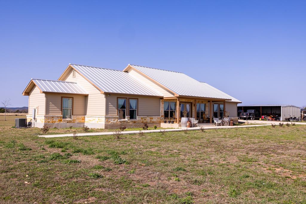 5025 Highway 16 Bandera, TX 78003 - Photo 29 of 49 a view of a house with swimming pool and a yard