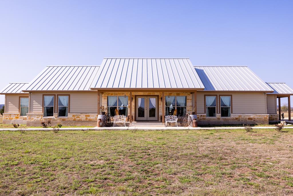 5025 Highway 16 Bandera, TX 78003 - Photo 30 of 49 a front view of a house with swimming pool and furniture