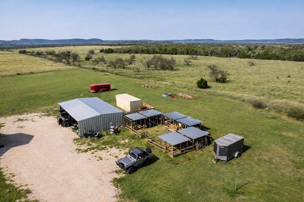 5025 Highway 16 Bandera, TX 78003 - Photo 5 of 49 a view of a lake with a yard and mountain view