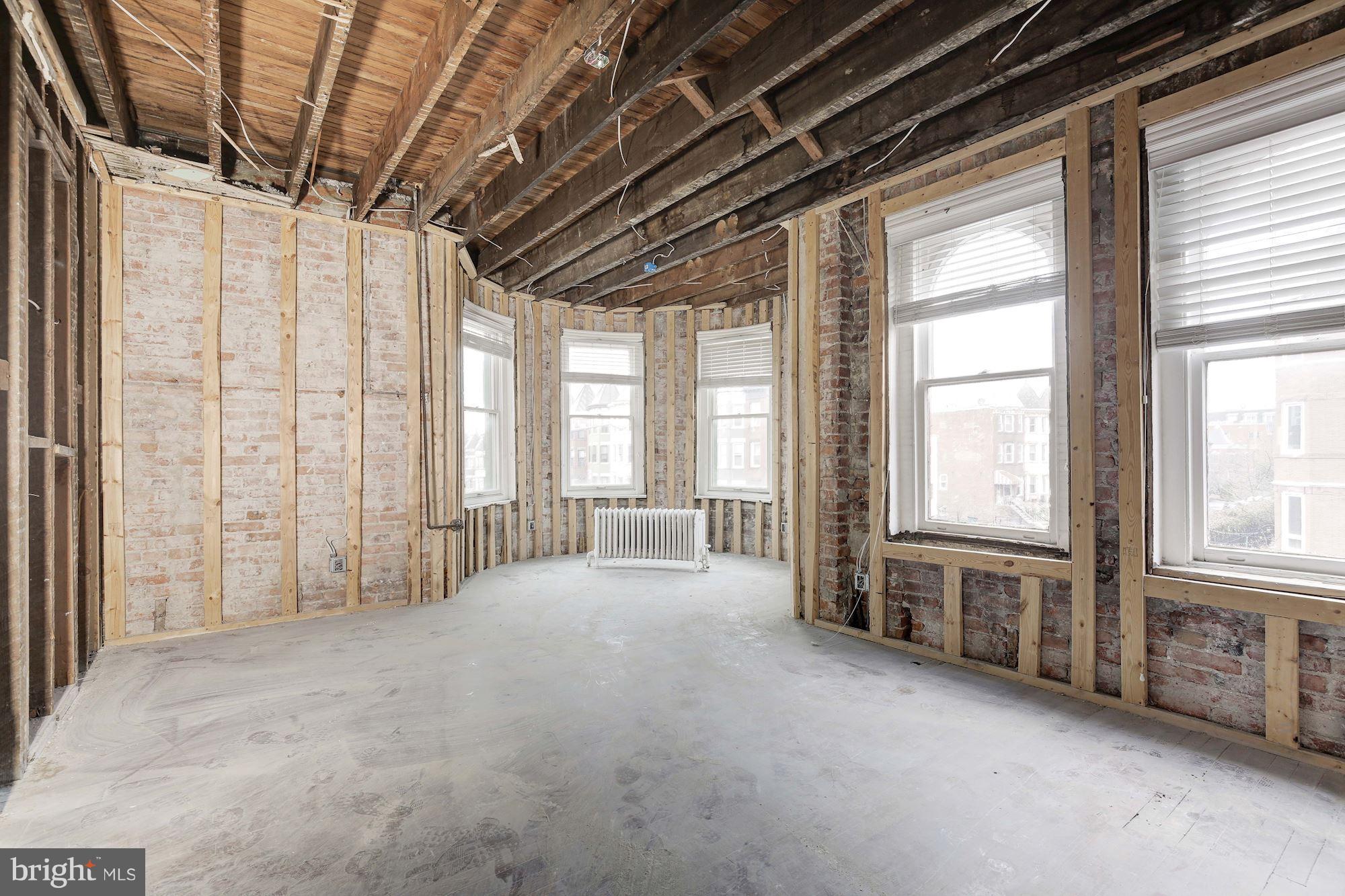 87 V Street Northwest Washington, DC 20001 - Photo 15 of 30 a view of an empty room with windows