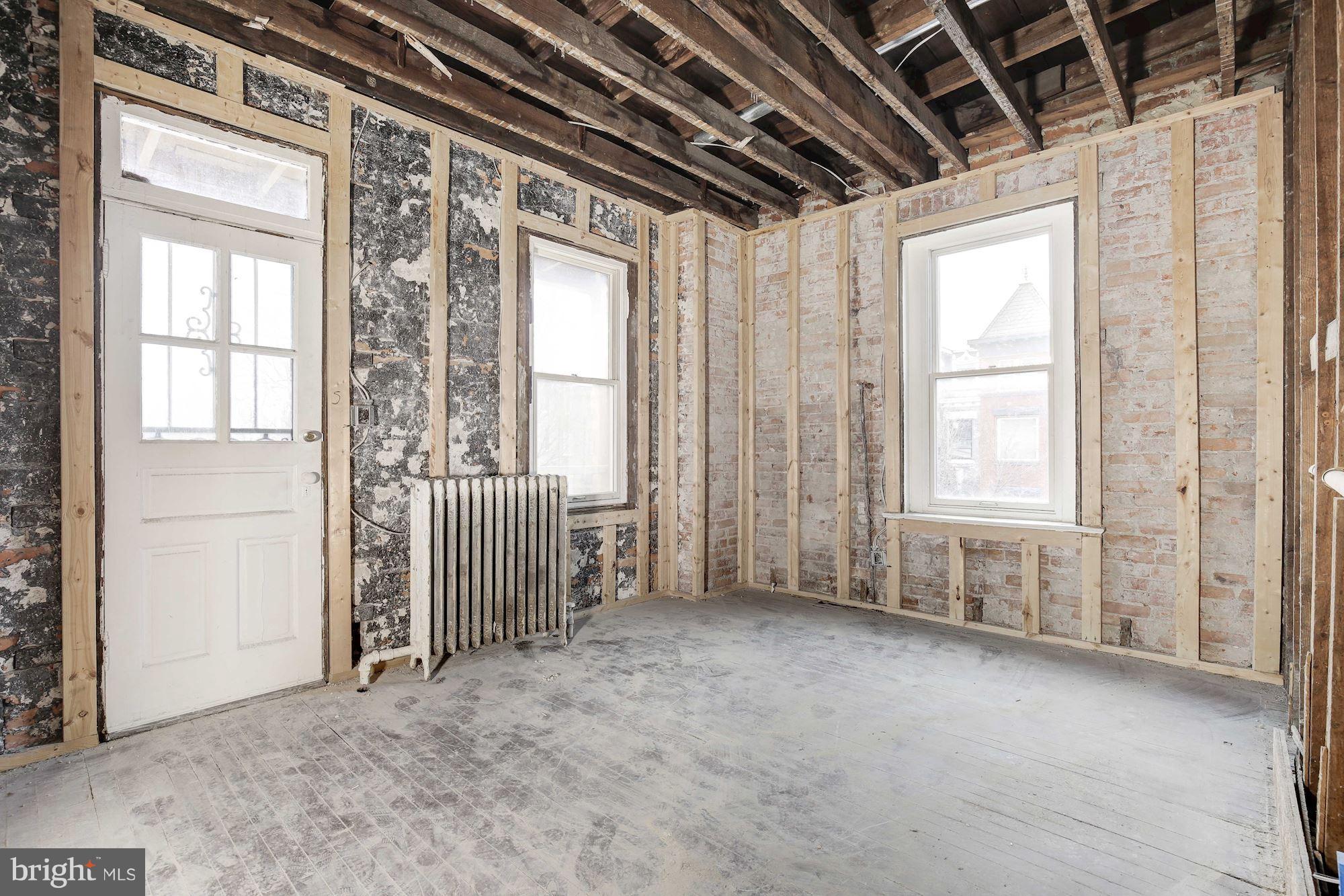 87 V Street Northwest Washington, DC 20001 - Photo 18 of 30 a view of empty room with wooden floor and fan