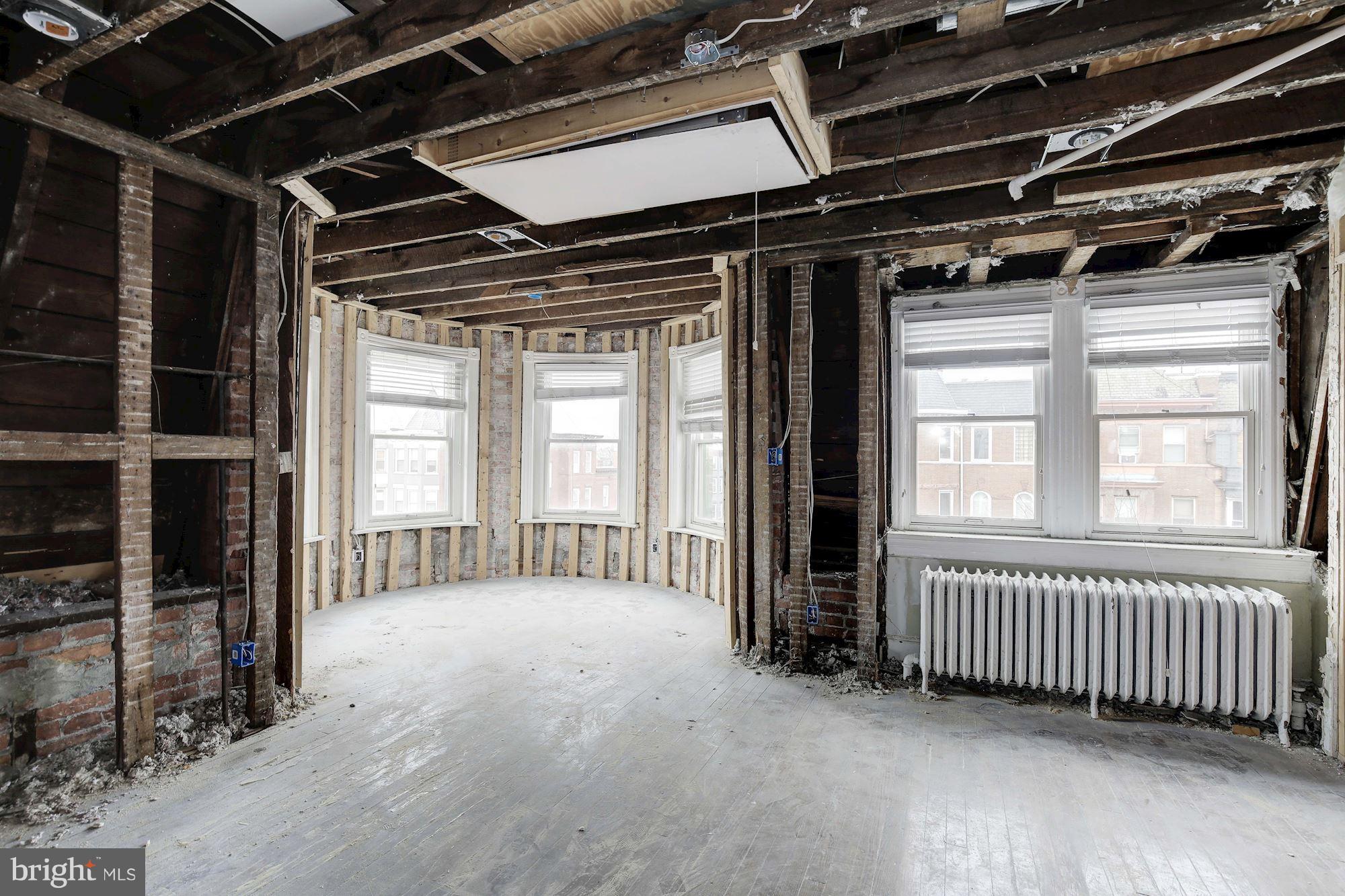 87 V Street Northwest Washington, DC 20001 - Photo 20 of 30 a view of an empty room with wooden floor
