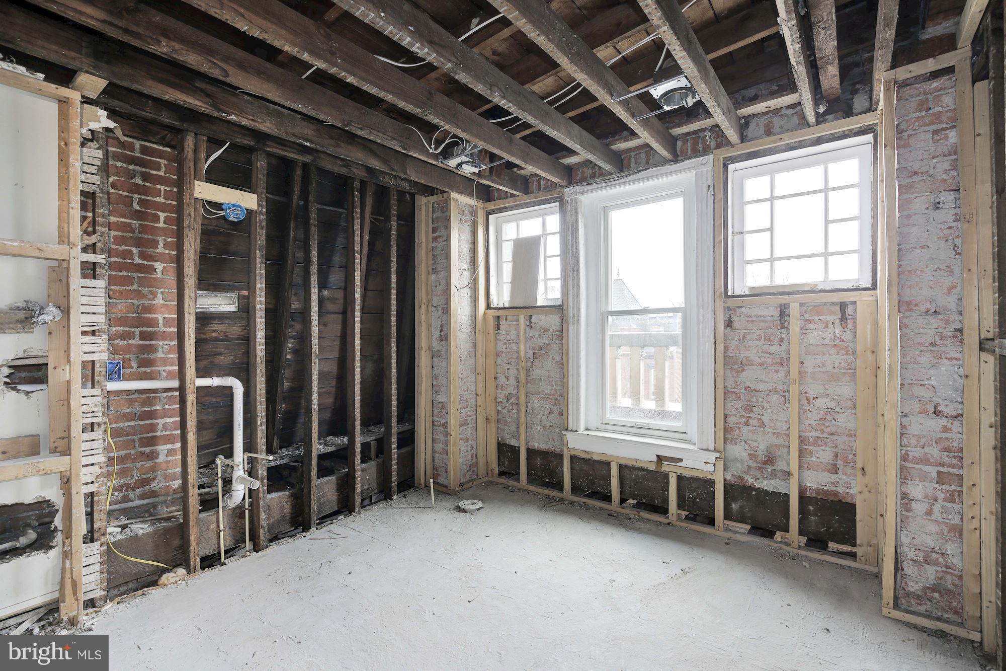 87 V Street Northwest Washington, DC 20001 - Photo 22 of 30 a view of an empty room with windows