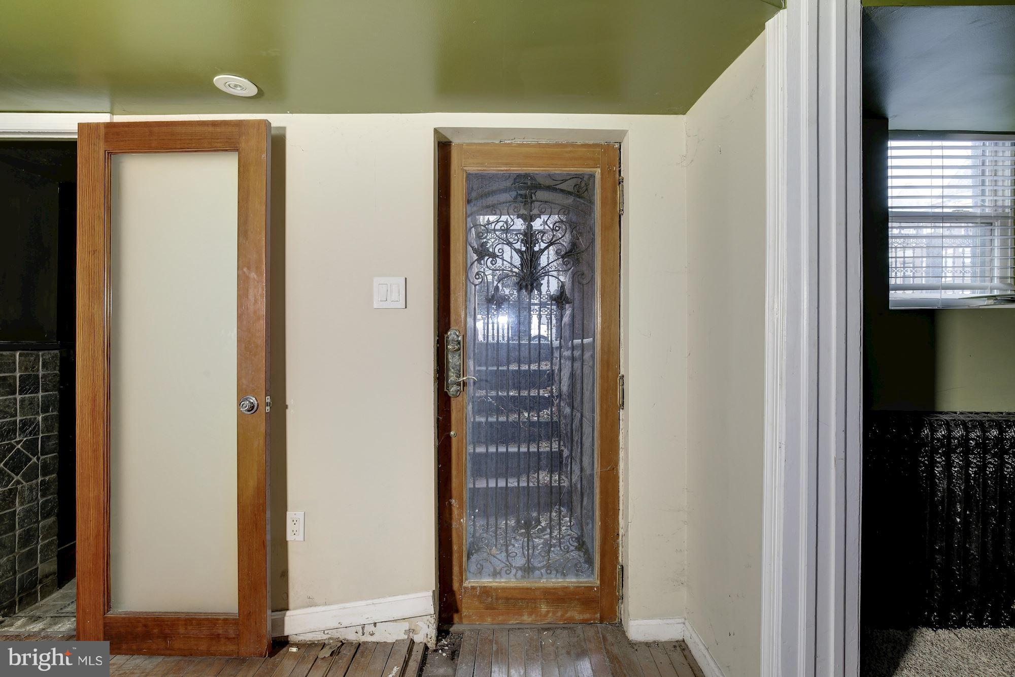 87 V Street Northwest Washington, DC 20001 - Photo 24 of 30 a view of a hallway with wooden floor and a bathroom