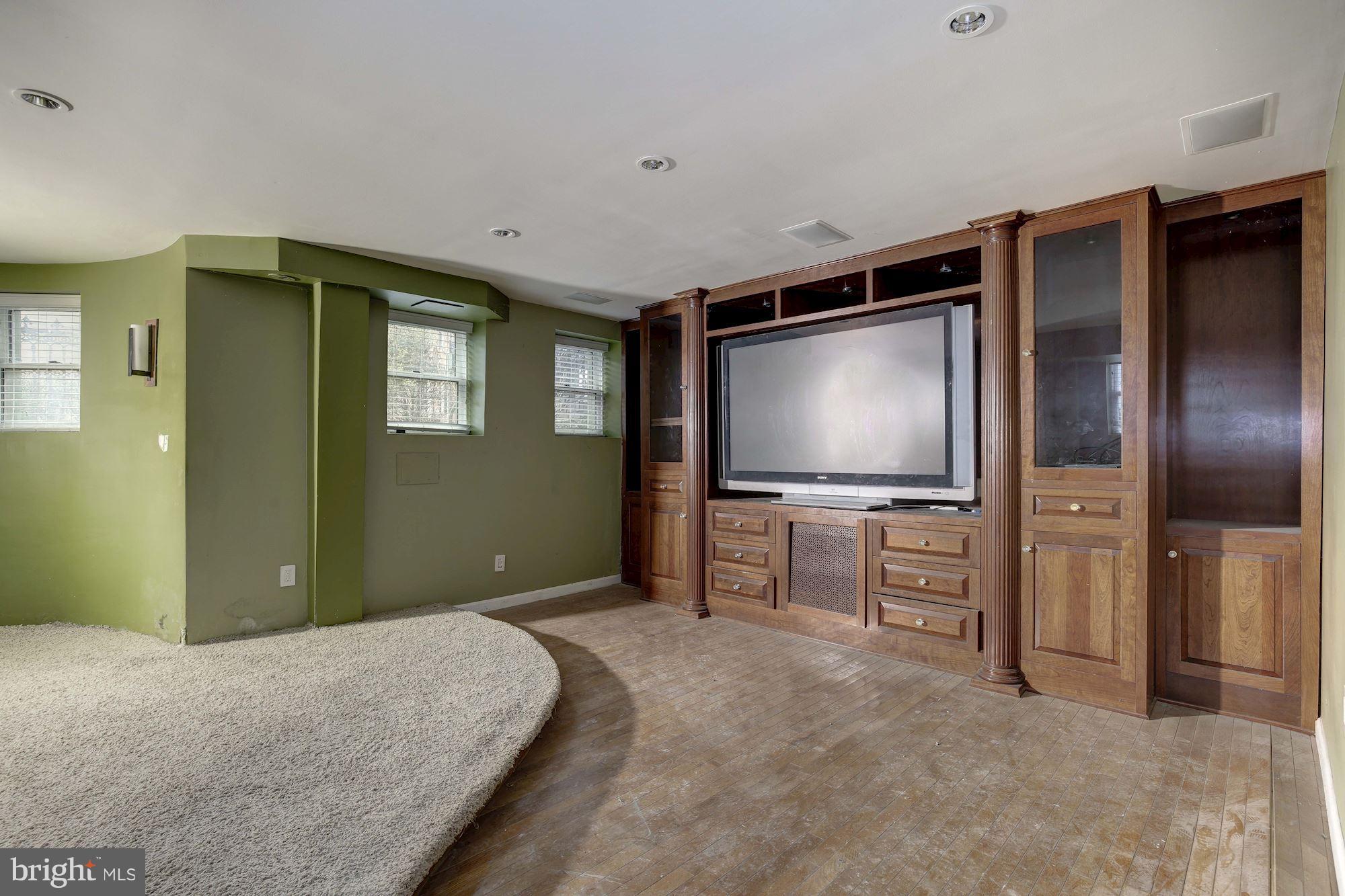 87 V Street Northwest Washington, DC 20001 - Photo 25 of 30 a bedroom with furniture and flat screen tv