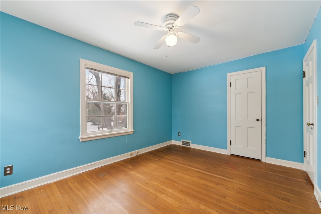 1542 Kew Road Cleveland, OH 44118 - Photo 18 of 23 Unfurnished bedroom with hardwood / wood-style floors and ceiling fan