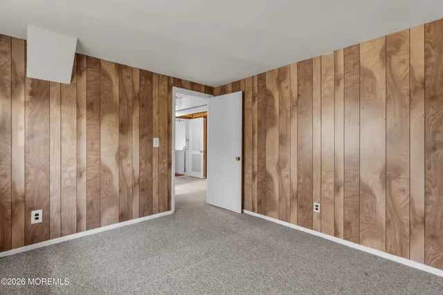 a view of a house with a patio and a yard