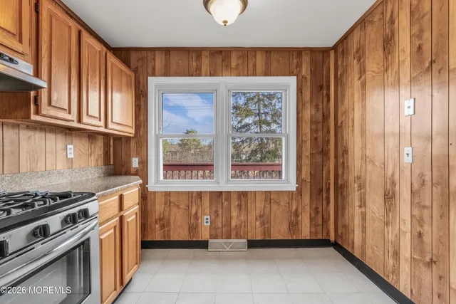 a kitchen with a stove and a kitchen