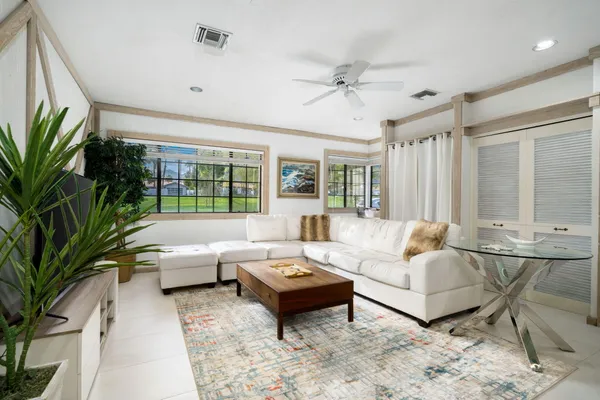 a living room with furniture and a large window