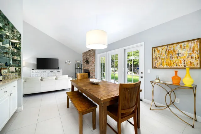 a view of a dining room with furniture and window