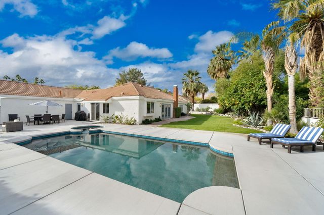 a view of a house with swimming pool