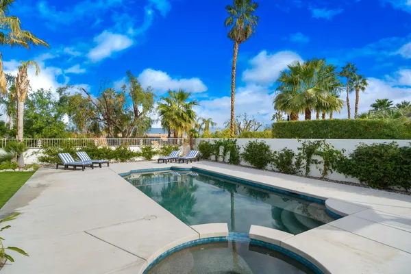 a view of a swimming pool with a patio