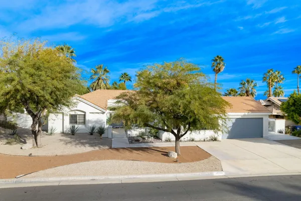 a view of a house with a street