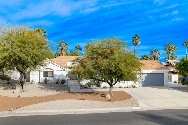 a view of a house with a street