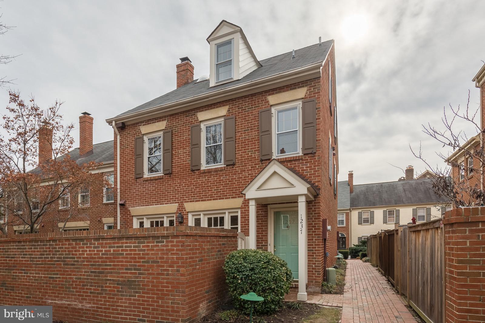 1237 Portner Road Alexandria, VA 22314 - Photo 1 of 17 a front view of a house with a yard