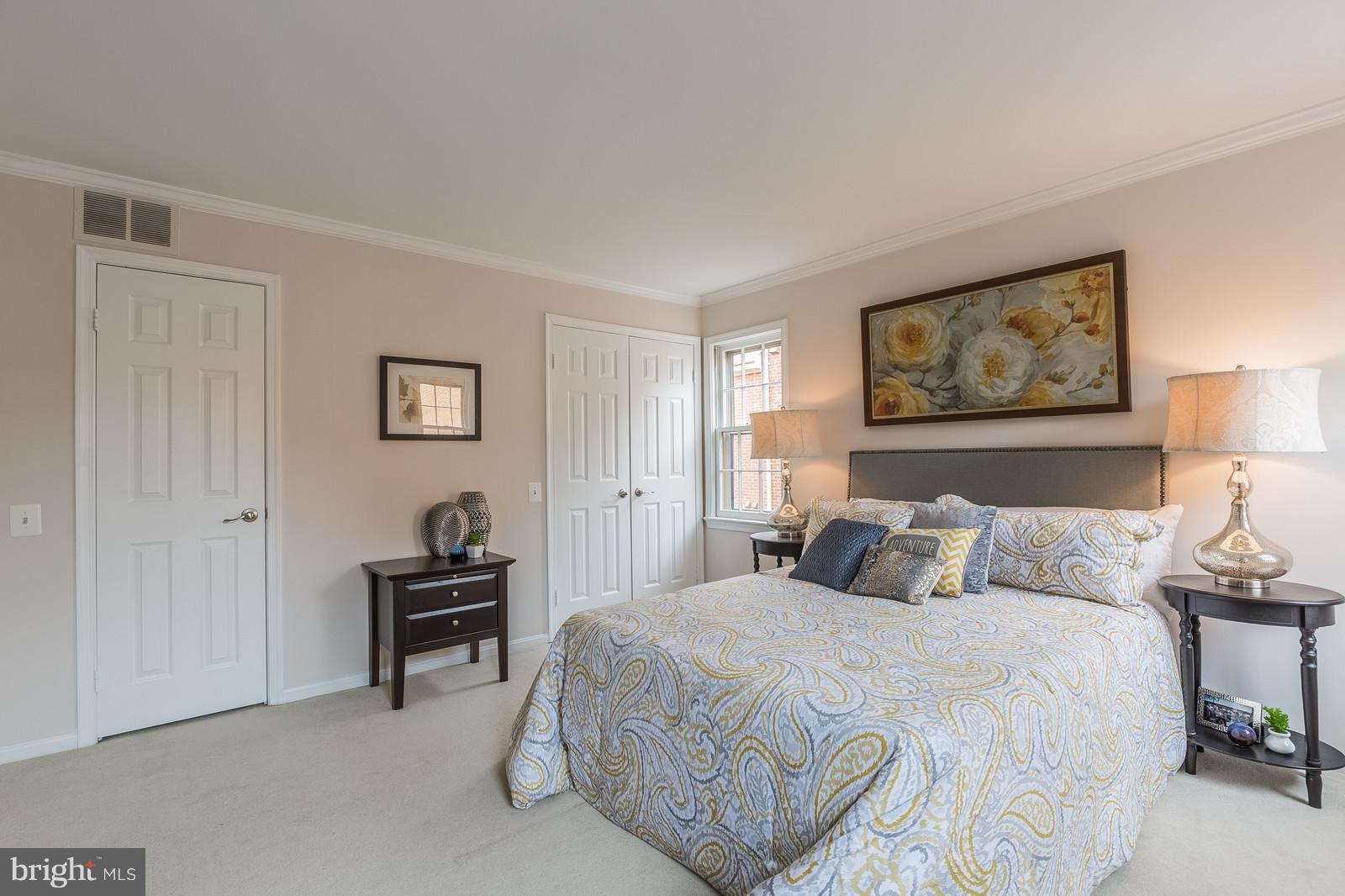 1237 Portner Road Alexandria, VA 22314 - Photo 11 of 17 a bedroom with a bed and a painting on the wall