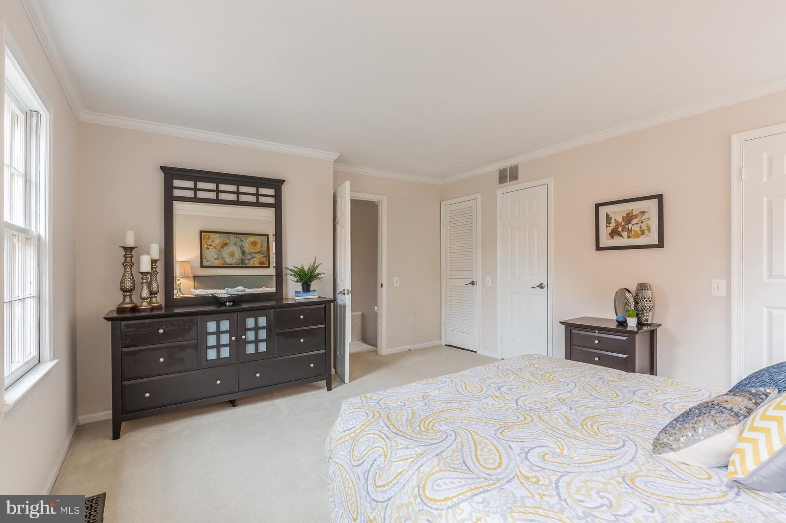 1237 Portner Road Alexandria, VA 22314 - Photo 12 of 17 a bedroom with a bed and a dresser
