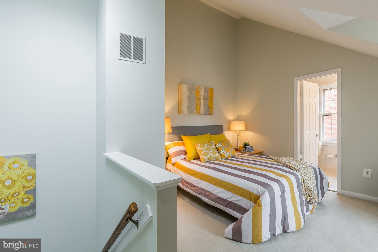 1237 Portner Road Alexandria, VA 22314 - Photo 15 of 17 a bedroom with a bed and lamps