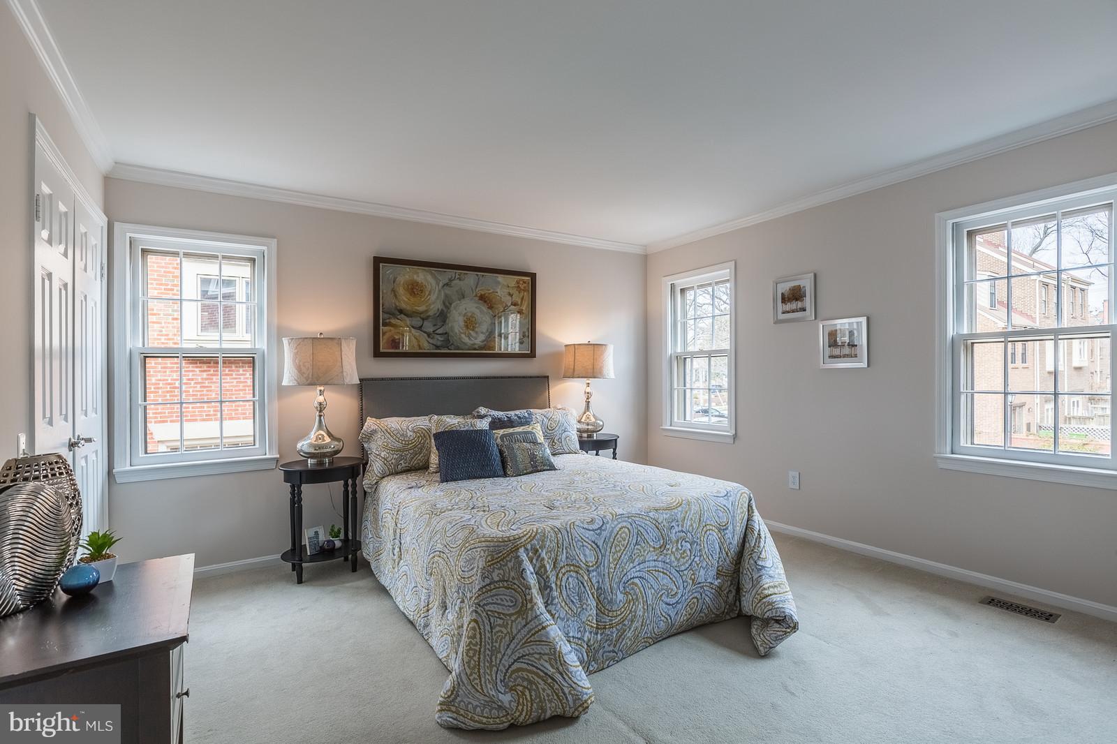 1237 Portner Road Alexandria, VA 22314 - Photo 10 of 17 a bedroom with a bed couch and windows
