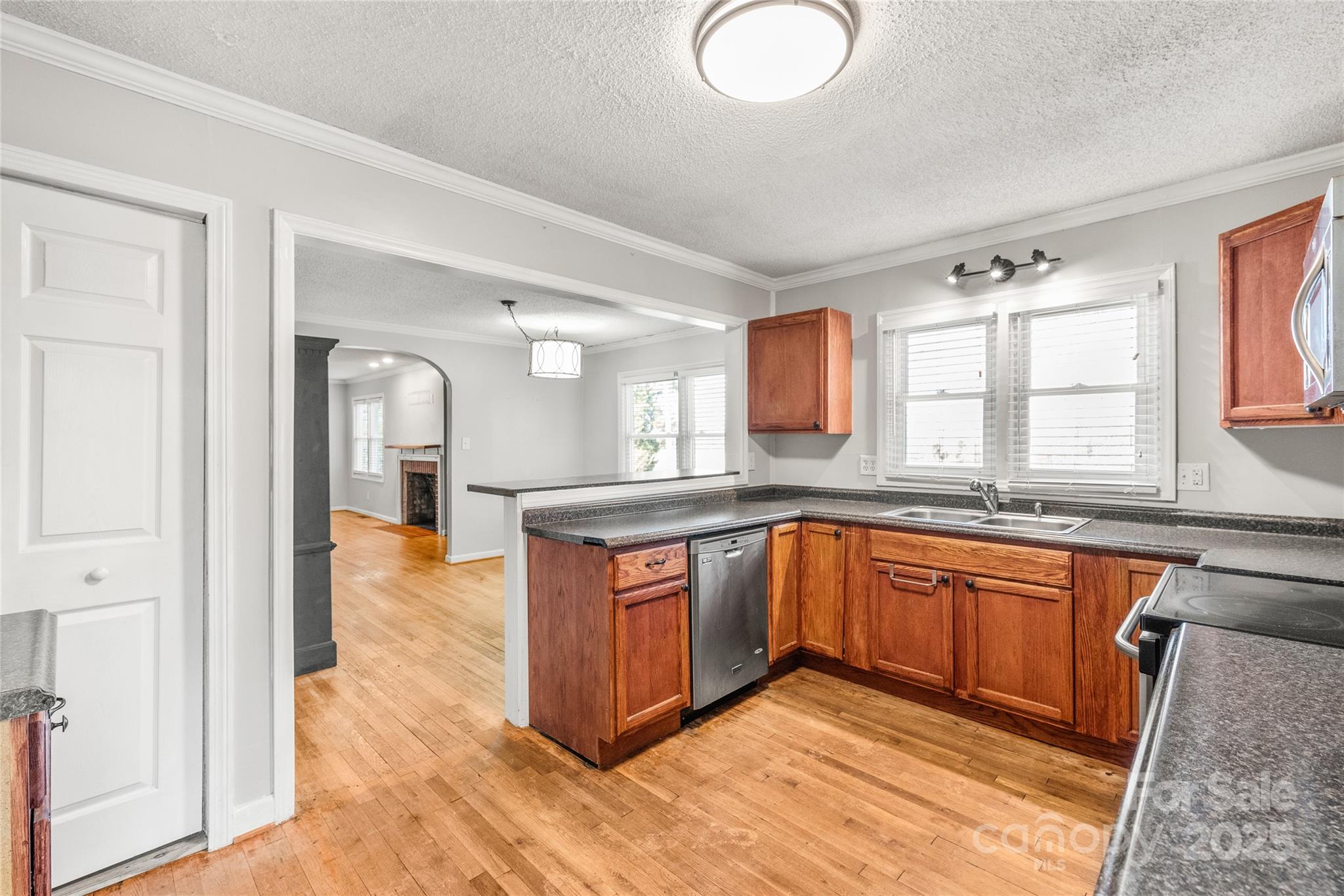 3933 Fallston-Waco Road Lawndale, NC 28090 - Photo 13 of 48 a large kitchen with kitchen island granite countertop wooden cabinets a granite counter tops and a sink