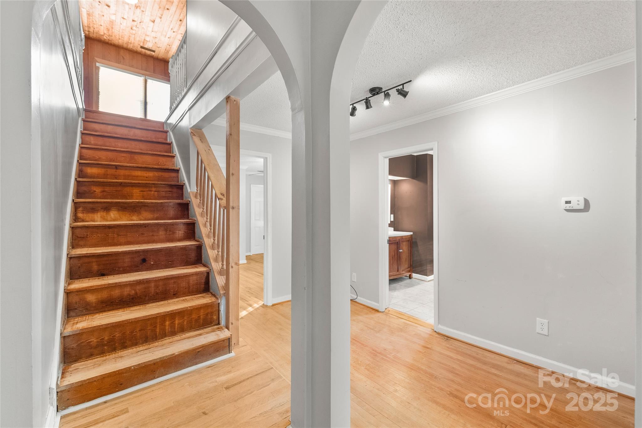3933 Fallston-Waco Road Lawndale, NC 28090 - Photo 16 of 48 a view of a hallway with wooden floor and windows