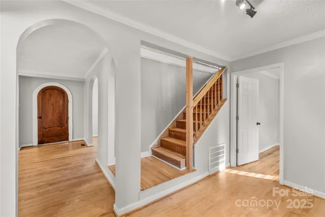 a view of a hallway view with staircase