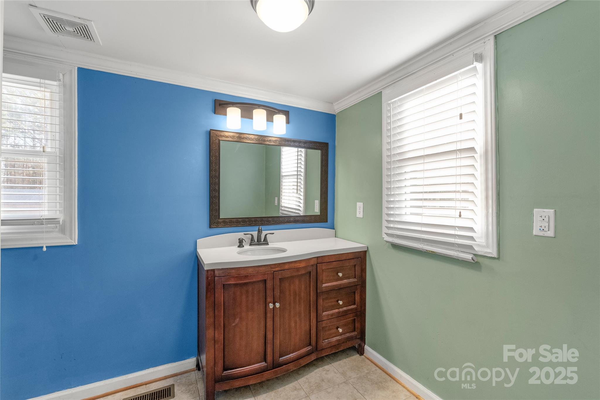 3933 Fallston-Waco Road Lawndale, NC 28090 - Photo 20 of 48 a bathroom with a sink and a mirror
