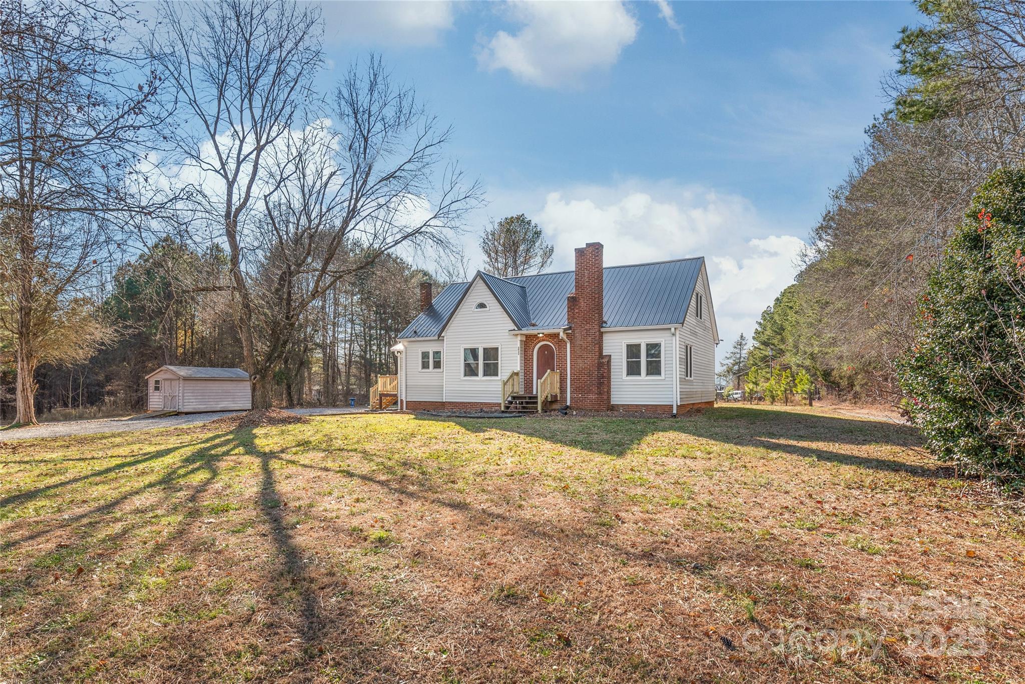 3933 Fallston-Waco Road Lawndale, NC 28090 - Photo 2 of 48 a view of a house with snow on the side of the road
